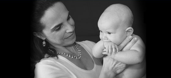 Dr. Aguiar holding a baby